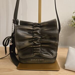 Charles & Keith Kadee Ruched Bow-Charm Mini Bag in Burnished Brown.